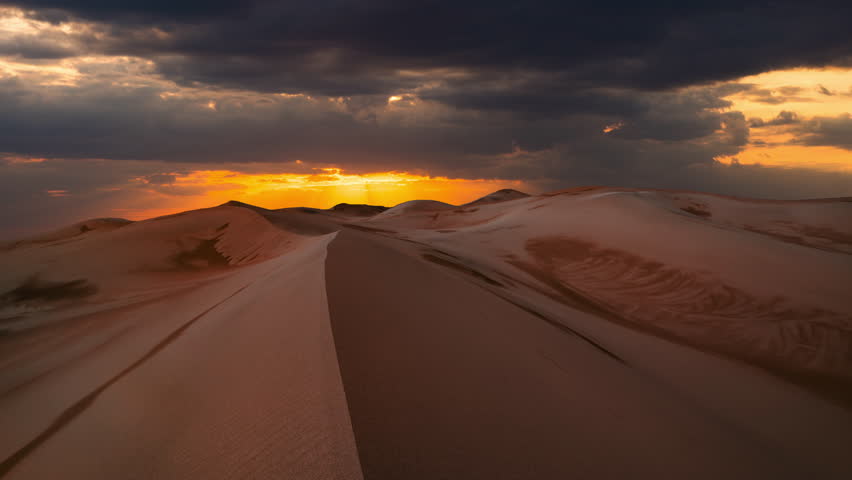 Timelapse of sunset over the sand dunes in the desert. Gobi desert