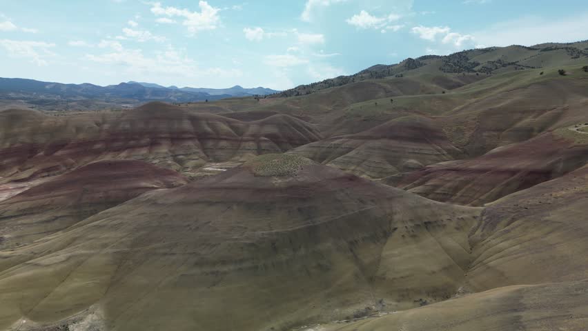 A drone footage of Painted Hills and John Day Fossil Beds Park on a sunny day in east-central Oregon, USA