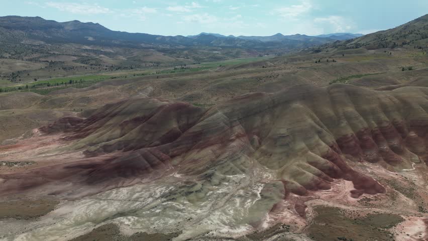A drone footage of the scenic Painted Hills and John Day Fossil Beds Park on a sunny day in east-central Oregon, USA