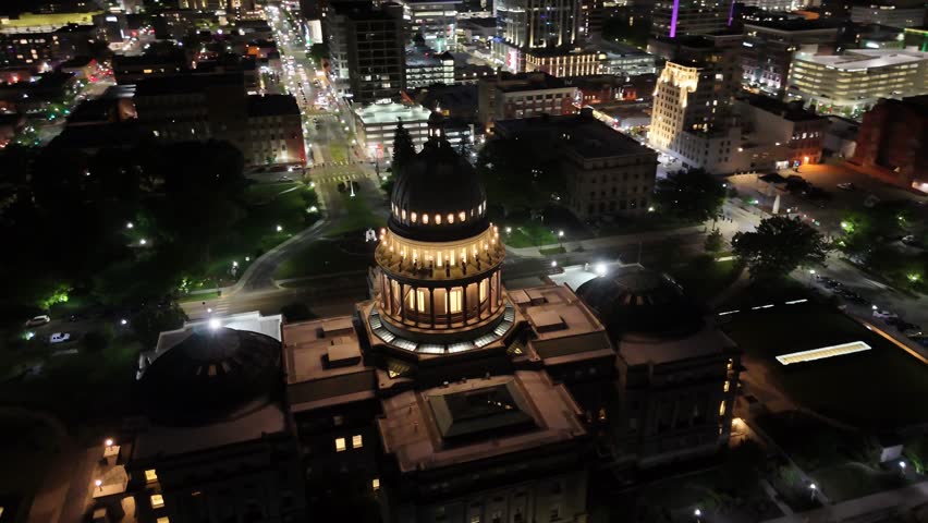 Boise State Capital drone video at night starting at the front of the building and moving around to the rear of the building look towards downtown