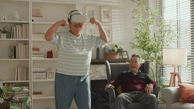 VR experience senior couple in living room metaverse video games innovation, digital fantasy and cyber connection. asian couple happy woman and excited people with virtual reality futuristic glasses - Powered by Shutterstock - Get 15% off with code: PIKWIZARD15