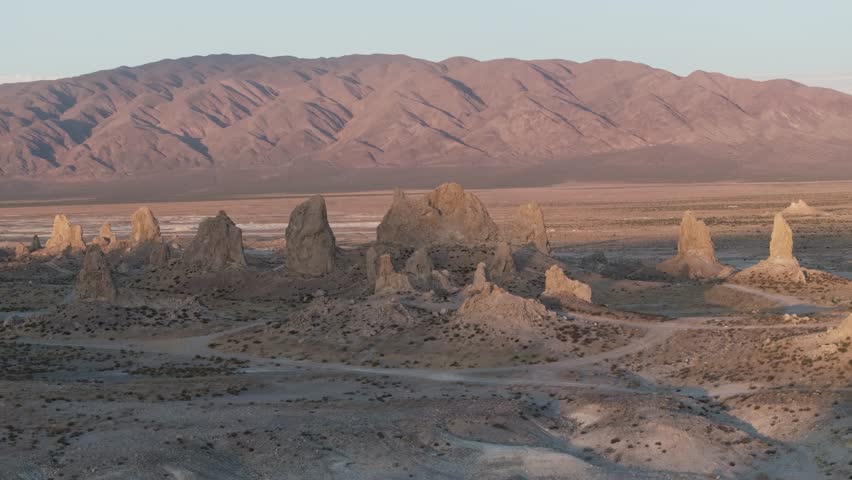 Aerial wide orbit over Trona Pinnacles, California during golden hour in the summer.