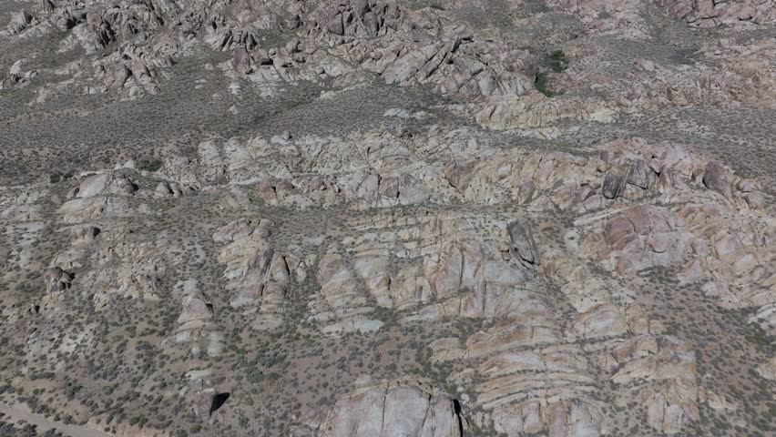 Aerial high wide push in and reveal of Mount Whitney, California and mountain range background on a summer morning.