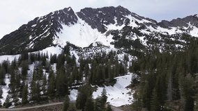 Aerial view of Pine forest With Snow Covered Mountains, Winter landscape in Austrian Alps, Europe - Powered by Shutterstock - Get 15% off with code: PIKWIZARD15