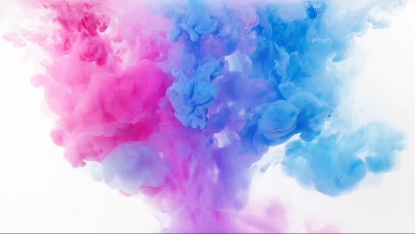 Drop of vivid ink descends gracefully into the water, instantly blooming like a slow-motion explosion. The ink expands and curls, creating swirling patterns that resemble plumes of colorful smoke.