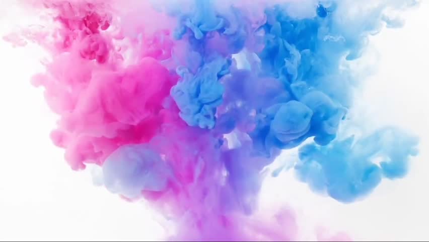 Drop of vivid ink descends gracefully into the water, instantly blooming like a slow-motion explosion. The ink expands and curls, creating swirling patterns that resemble plumes of colorful smoke.
