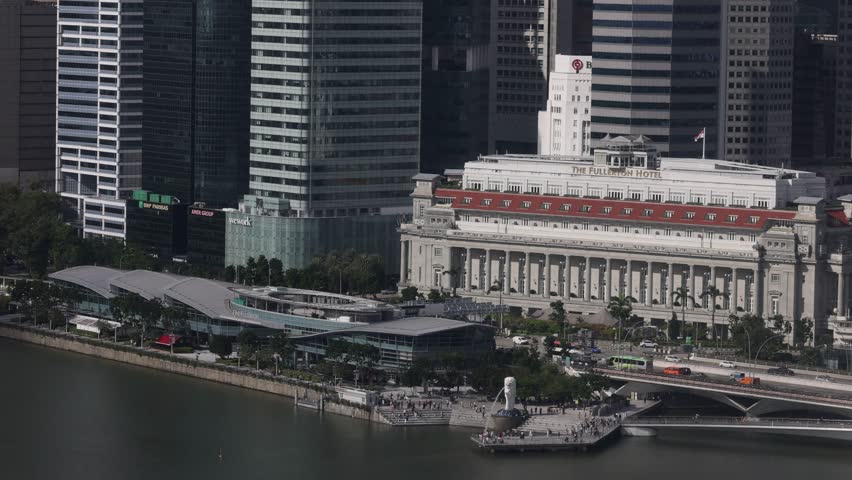 Singapore - 8 January 2024: Aerial drone view of Fullerton Hotel heritage building along Singapore River, Singapore - January 2024