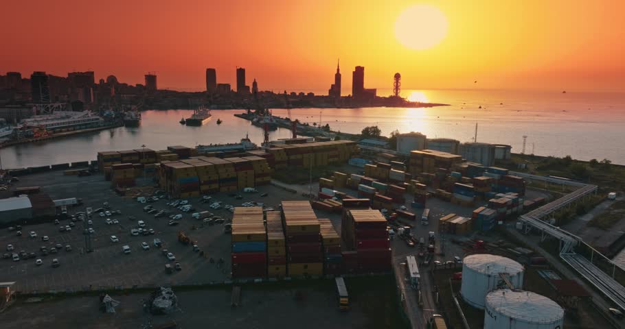 Container ships in the cargo dock ECT container terminal, Port of Batumi, gantry cranes for loading containers for world wide freight shipping supply chains
