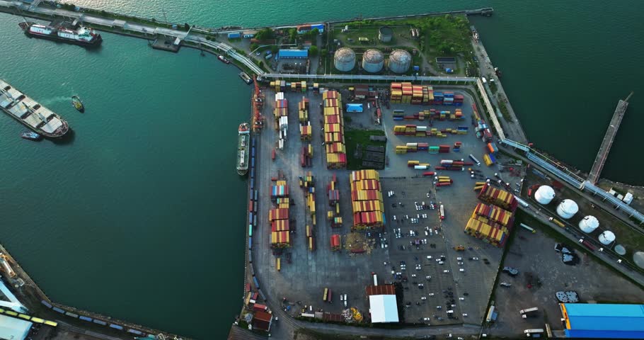 Container ships in the cargo dock ECT container terminal, Port of Rotterdam, gantry cranes for loading containers for world wide freight shipping supply chains