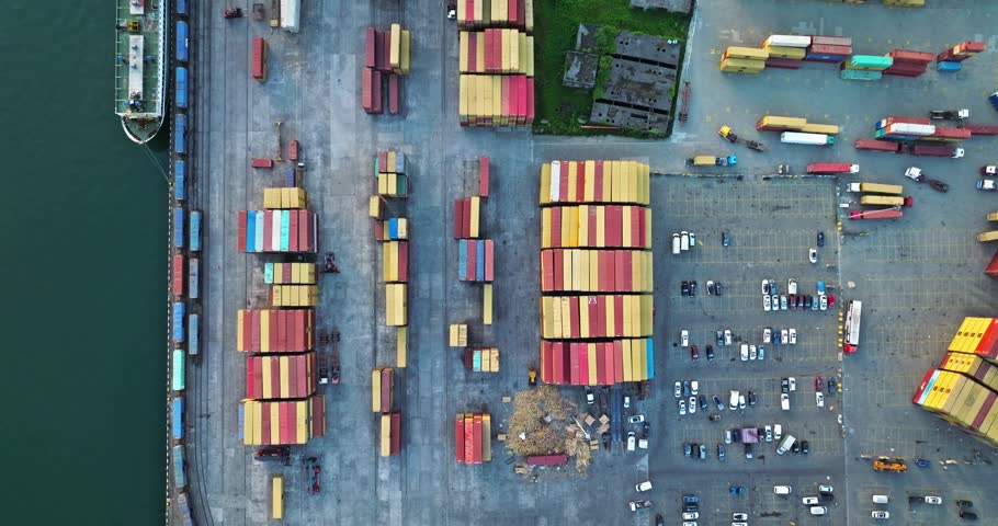 Container ships in the cargo dock ECT container terminal, Port of Batumi, gantry cranes for loading containers for world wide freight shipping supply chains