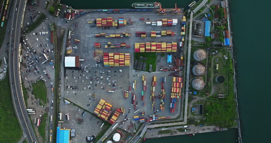 Container ships in the cargo dock ECT container terminal, Port of Batumi, gantry cranes for loading containers for world wide freight shipping supply chains