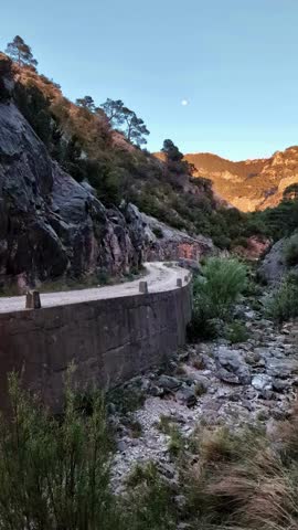 View of the waterless Barranc de la Vall d'Uixo in the evening. Parc Natural dels Ports. Spain water crisis. Vertical video.