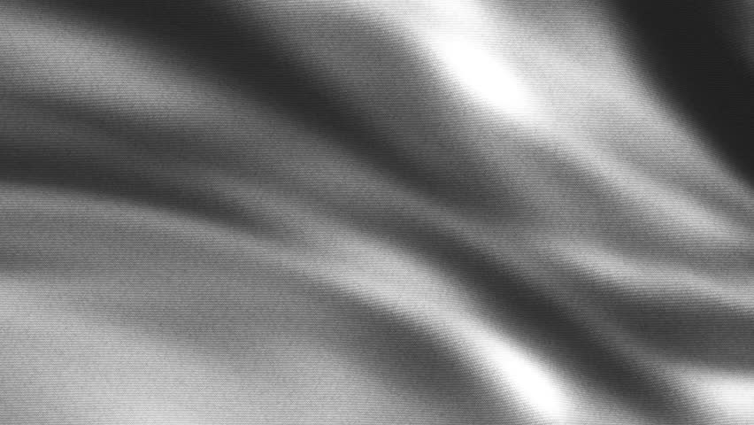 The video features a loop of a piece of cloth fluttering in the wind, showcasing the fabric's texture and movement dynamically.