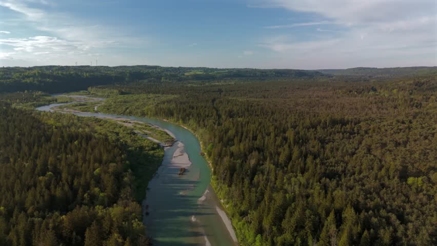 Aerial view Isar River and wind mills in sunny weather near town of Wolfratshausen in Bavaria, Germany. Luftaufnahme der Isar und der Windkraftwerke von Wolfratshausen in Bayern, Deutschland. 
