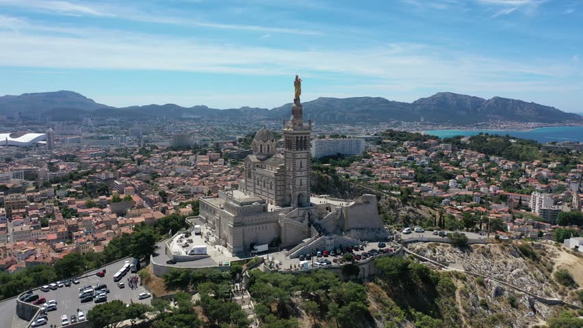 Video from a drone flying over the Basilica of Notre-Dame of la Garde over the city of Marseille, France, Provence on a sunny clear day
