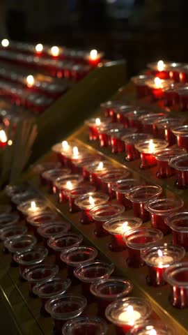 Candles in Notre Dame Cathedral. Paris, France. Before the fire. Close-up. Vertical shot.
