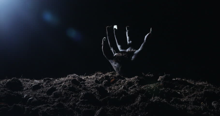 Zombie hand rising out from the ground
