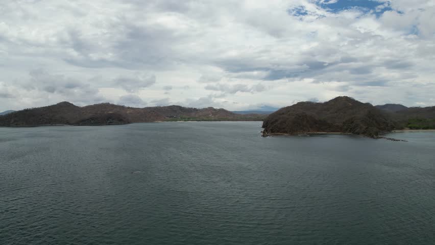 Glide over pacific ocean towards Playa El Jobo in Costa Rica