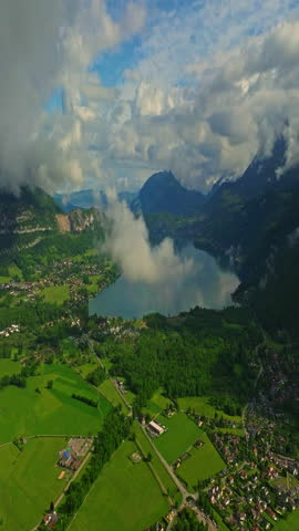 Scenic summer mountain landscape of French Alps with green hillsides, valleys and highland pastures. Mountain cloud top view landscape. Beautiful nature France natural landscape
