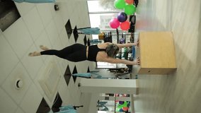 Woman at gym doing push ups, aerial yoga, handstand show dedication to fitness - Powered by Shutterstock - Get 15% off with code: PIKWIZARD15