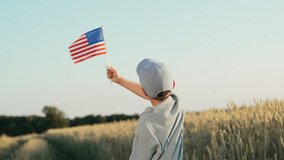 Unrecognizable american little boy patriot kid waving national flag on sky background. Symbol of democracy, independence, USA, future. - Powered by Shutterstock - Get 15% off with code: PIKWIZARD15