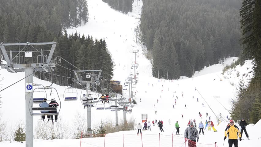 ski resort, chair ski lift elevator lifting people on the mountain ski slope,