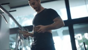 4K Strong Caucasian man athlete wear weight lifting belts do sport training workout exercise weight lifting barbell at fitness gym. Sportsman bodybuilding with weight training equipment at sport club. - Powered by Shutterstock - Get 15% off with code: PIKWIZARD15