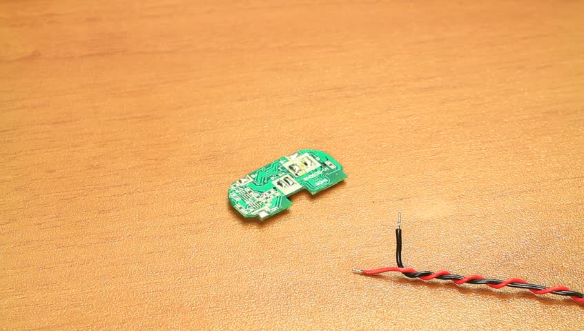 Soldering on circuit board. Electronic technician soldering wires to circuit