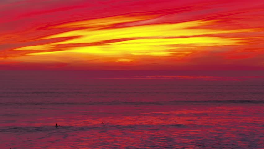 Stunning aerial shots of the Pacific Ocean during a colorful sunset in Pacific Bech San Diego California with vivid orange pink purple and red sky