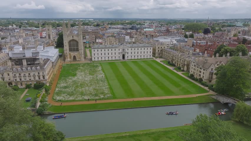 Aerial view of the old town of Cambridge with narrow canals and river boats near a Kings College Chapel in the center of Cambridge, Cambridgeshire, England. 