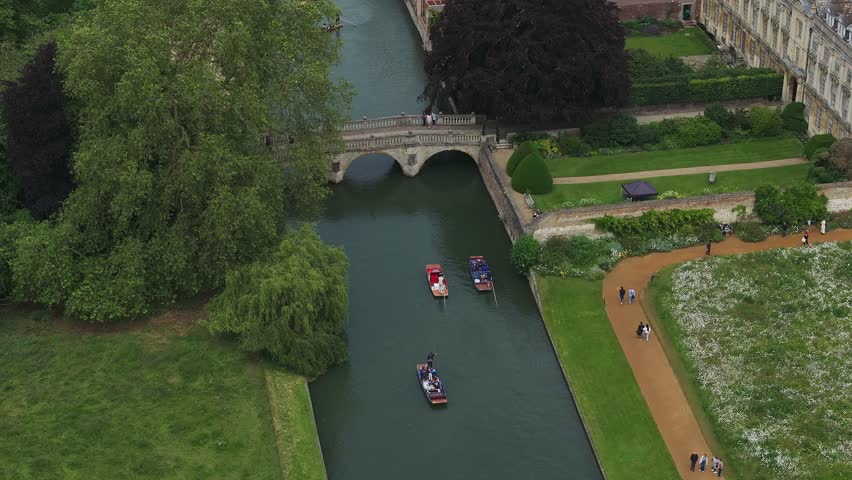 Aerial view of the old town of Cambridge with narrow canals and river boats near a Kings College Chapel in the center of Cambridge, Cambridgeshire, England. 
