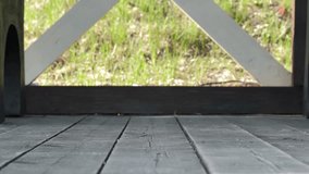 male feet in old worn shoes come and sit on bench. man crosses his legs. sole of shoes is close up. concept of poverty, homelessness. - Powered by Shutterstock - Get 15% off with code: PIKWIZARD15