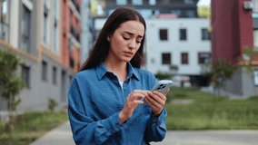 Worried businesswoman getting upsetting news while reading a text message on her phone. - Powered by Shutterstock - Get 15% off with code: PIKWIZARD15