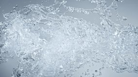 Super Slow Motion Shot of Pure Water Splashes Flying Towards on Light Blue Background at 1000fps. - Powered by Shutterstock - Get 15% off with code: PIKWIZARD15