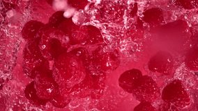 Super Slow Motion Shot of Raspberries Followed by Camera Splashing into Water at 1000 fps. - Powered by Shutterstock - Get 15% off with code: PIKWIZARD15