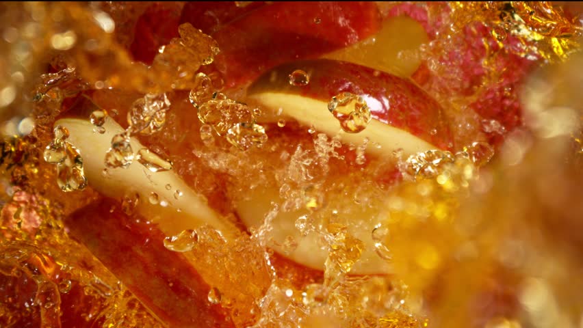 Super Slow Motion Shot of Red Apple Cuts Followed by Camera Splashing into Juice at 1000 fps. - Powered by Shutterstock - Get 15% off with code: PIKWIZARD15