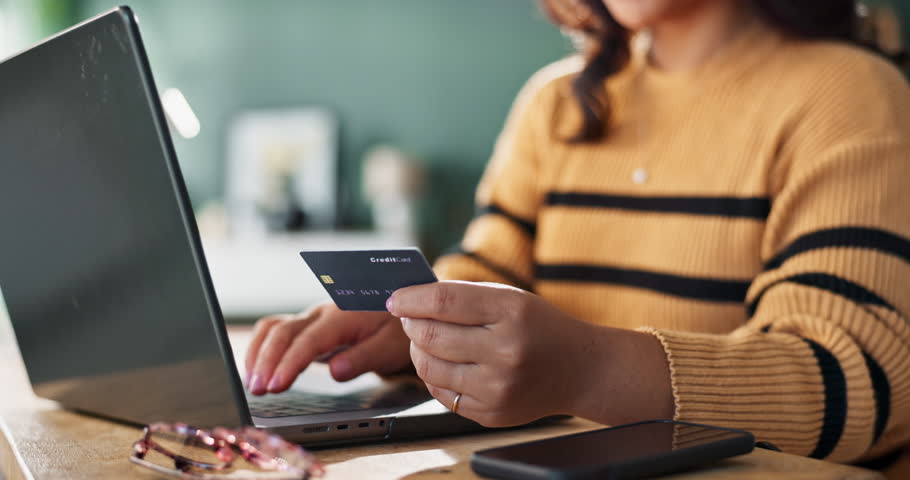 Home, laptop and woman with credit card, hands and internet for online shopping, ecommerce and payment. Closeup, apartment and person with computer, transactions and banking app for finance or budget