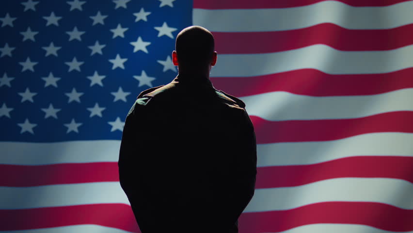 American soldier doing saluting hand gesture towards USA flag in command center, showing respect. Military unit in uniform serving in United States Armed Forces, doing patriotic gesturing, camera B - Powered by Shutterstock - Get 15% off with code: PIKWIZARD15
