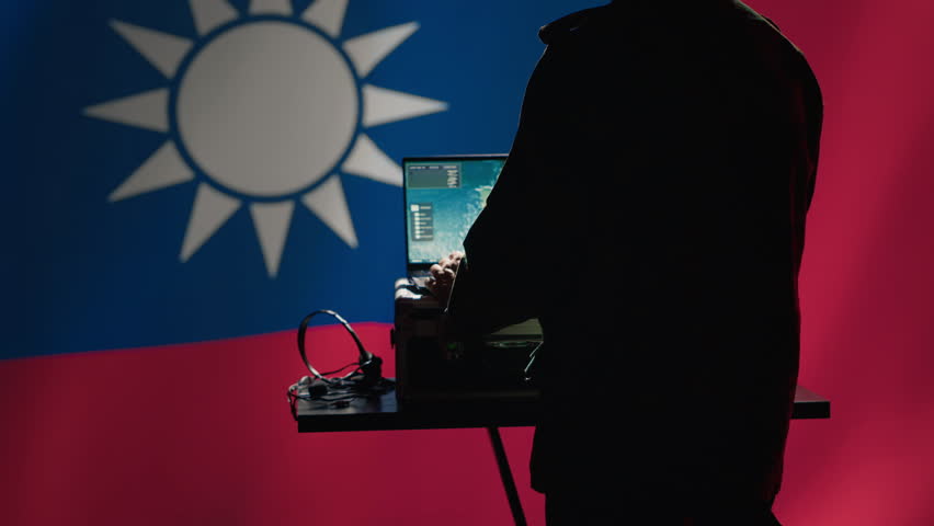Communication systems operator working for Taiwanese freedom fighters uses radio and satellite equipment. Taiwan army unit manages broadcasting networks during territorial dispute with China, camera A
