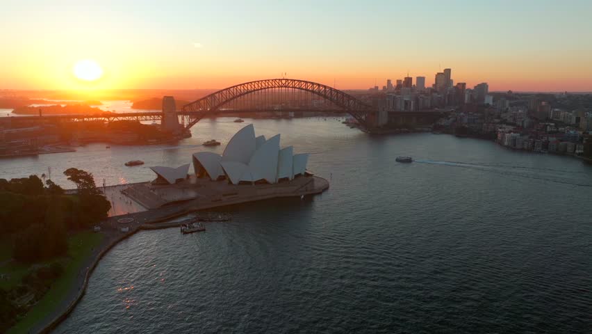 Sydney Opera House Harbour Bridge Vivid Australia aerial drone golden hour sunset Circular Quay Royal Botanic Gardens scenic helicopter flight ferry boats orange sunny skyline circle right