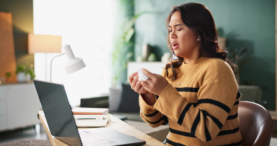 Remote work from home, sneeze and woman with tissue, virus and flu season with burnout, laptop and sick. Person, entrepreneur and freelancer with stress, illness and deadline with cold and allergies