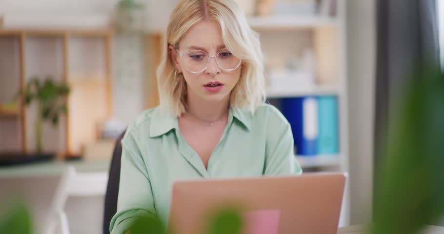 A woman is upset because her computer isn't working.