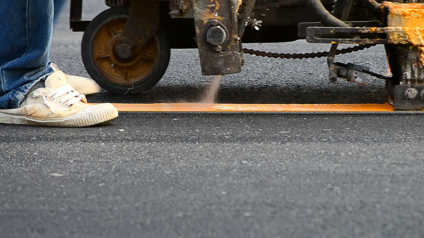 small machine paint line on road