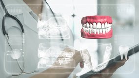 Dentist Doctor examining human body anatomy part on tablet with help of augmented reality Halo gram Interface screen. - Powered by Shutterstock - Get 15% off with code: PIKWIZARD15