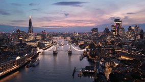 London aerial cityscape twilight view with illuminated Tower Bridge over Thames - Powered by Shutterstock - Get 15% off with code: PIKWIZARD15
