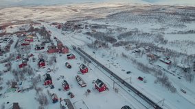 Stunning Aerial Shot Over Red Houses in Winter in Abisko, Sweden. 4K Drone - Powered by Shutterstock - Get 15% off with code: PIKWIZARD15