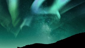 Aurora and Milky Way Night Harmony Above Hills Loop - Powered by Shutterstock - Get 15% off with code: PIKWIZARD15