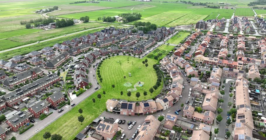 Modern build residential area, familiy friendly homes. Green and playground. Aerial view.