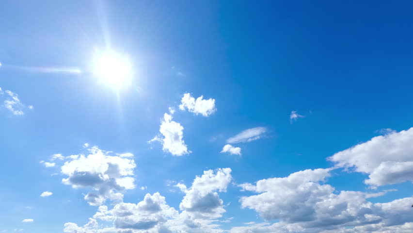 Blue Sky with White Clouds. Puffy Fluffy White Clouds Moving Fast. Cumulus Cloudscape Timelapse. Summer Nature Weather Sky Time Lapse Video