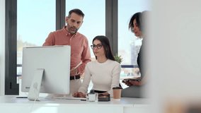Video of successful business multiage team standing around computer for presentation of work in the coworking space. - Powered by Shutterstock - Get 15% off with code: PIKWIZARD15